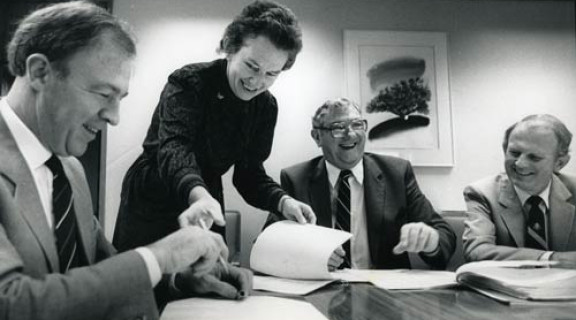 John Grant signing his contract as director-general of the Social Welfare Department in 1988