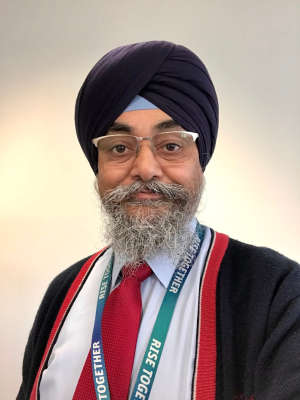 Bhupinder D Singh looking at the camera and smiling