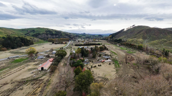Aerial view of Eskdale after the flood showing mud and debris across the valley plains