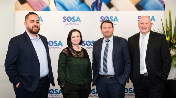 The Driver Licensing Improvement Programme team standing side-by-side and smiling at the camera