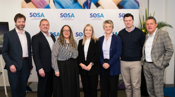 The Identity Check team standing side-by-side and smiling at the camera