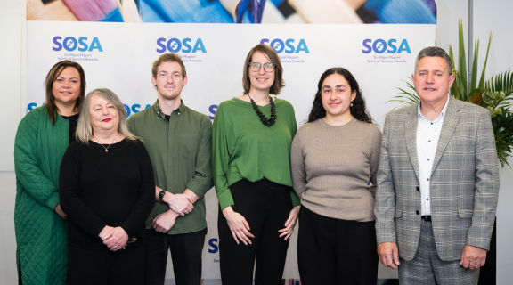 The Love Better team standing side-by-side and smiling at the camera