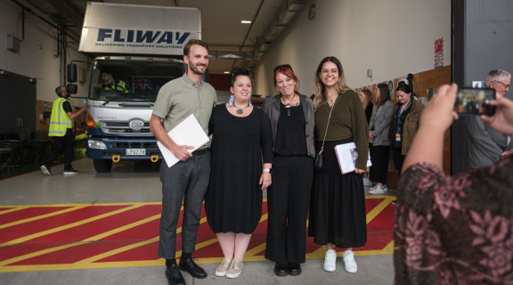 Kiriana Haze and Luke Stenner from Manatū Taonga and Nadia Wesley Smith and Rachel Wesley from Ōtākou Marae standing in front of a truck carrying taonga tūturu at the Ngāi Tahu Repatriation Ceremony