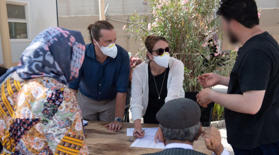 MFAT officials talking with recently evacuated Afghans at Al Minhad, United Arab Emirates