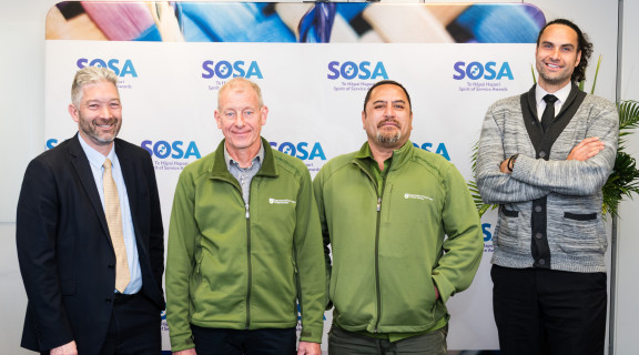 The National Predator Control Programme team standing side-by-side and smiling at the camera