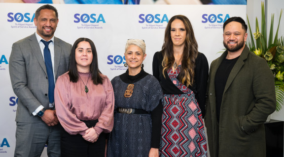 ACC team standing side-by-side and smiling at the camera