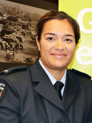 Tayla Yandall wearing Corrections uniform looking at the camera and smiling