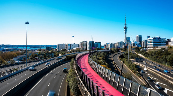Auckland motorway and cycleway with Sky Tower in the distance