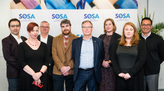 The Zero Data team standing side-by-side and smiling at the camera