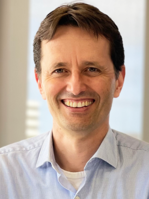 Hugo Vitalis looking at the camera and smiling