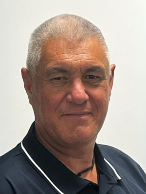 Headshot of Greg Nicholls looking at the camera