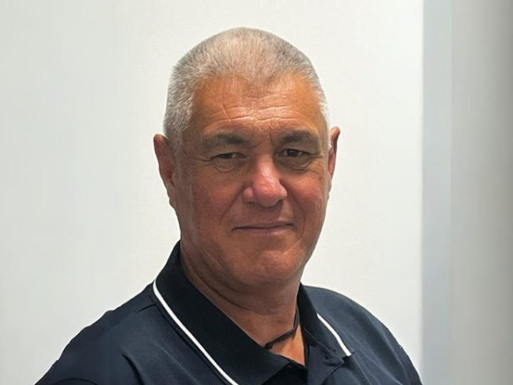 Headshot of Greg Nicholls looking at the camera