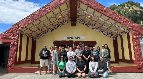 The 2023 cohort standing in front of Hinerupe Marae in Te Araroa